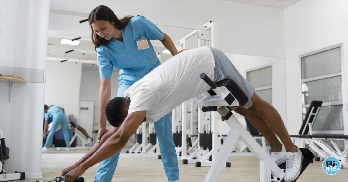 Physiotherapist assisting patient while he is exercising